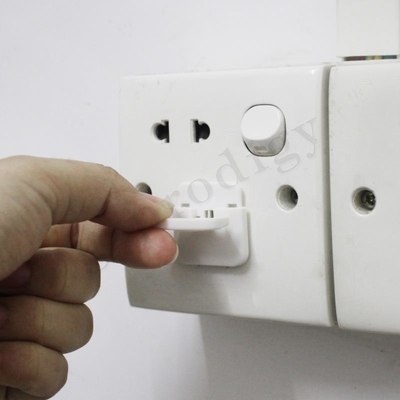 El enchufe no tóxico plástico universal del mercado de los E.E.U.U. cubre blanco para proteger a niños contra peligro eléctrico